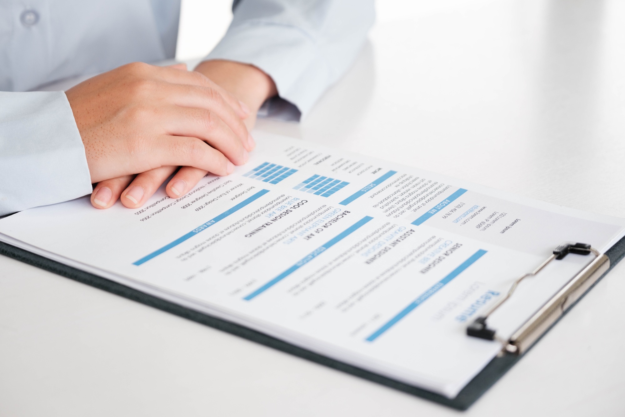 Close-Up of Businessman Holding a Resume.